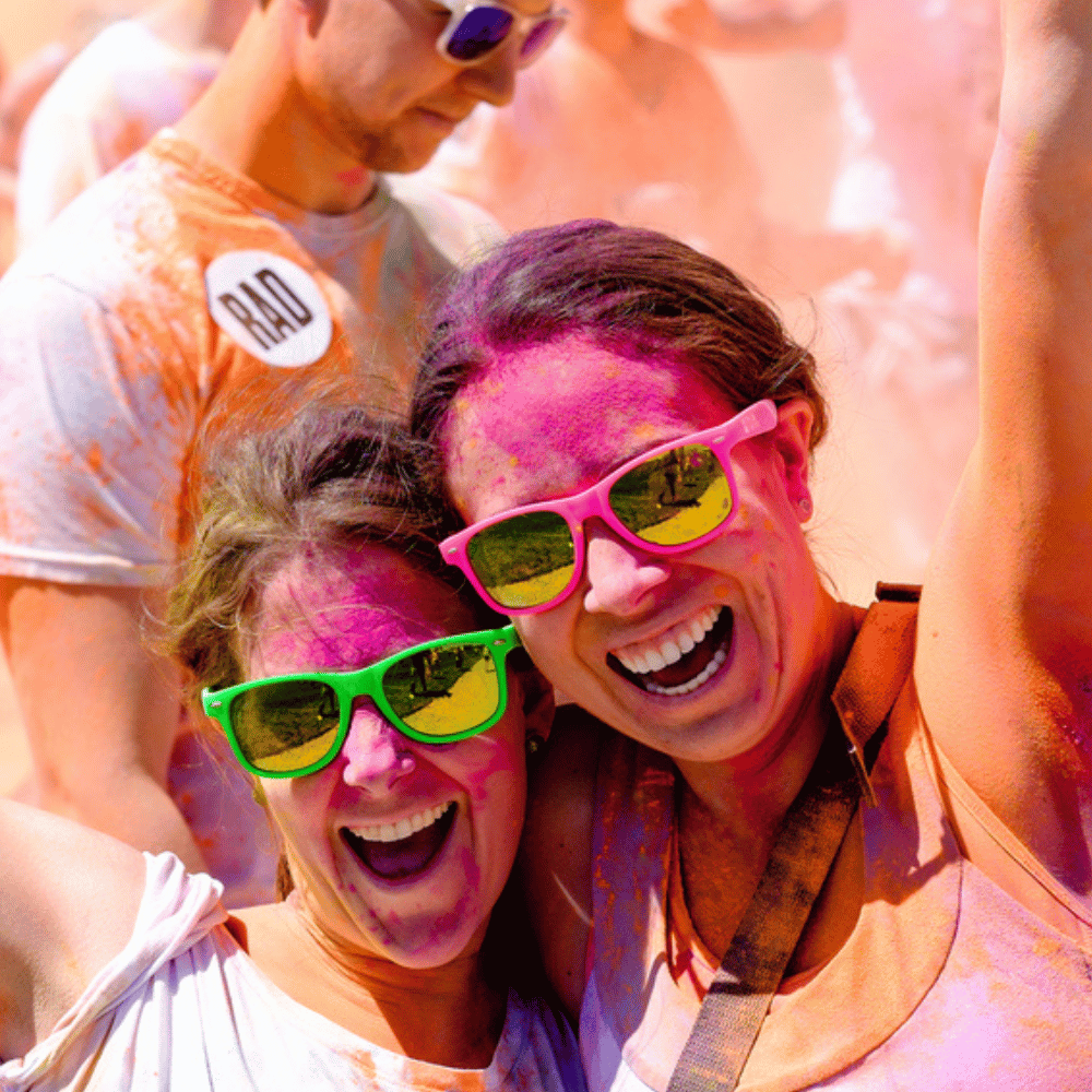 girls wearing colored sunglasses