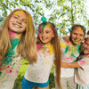Kids wearing white t-shirt with colour powders on it